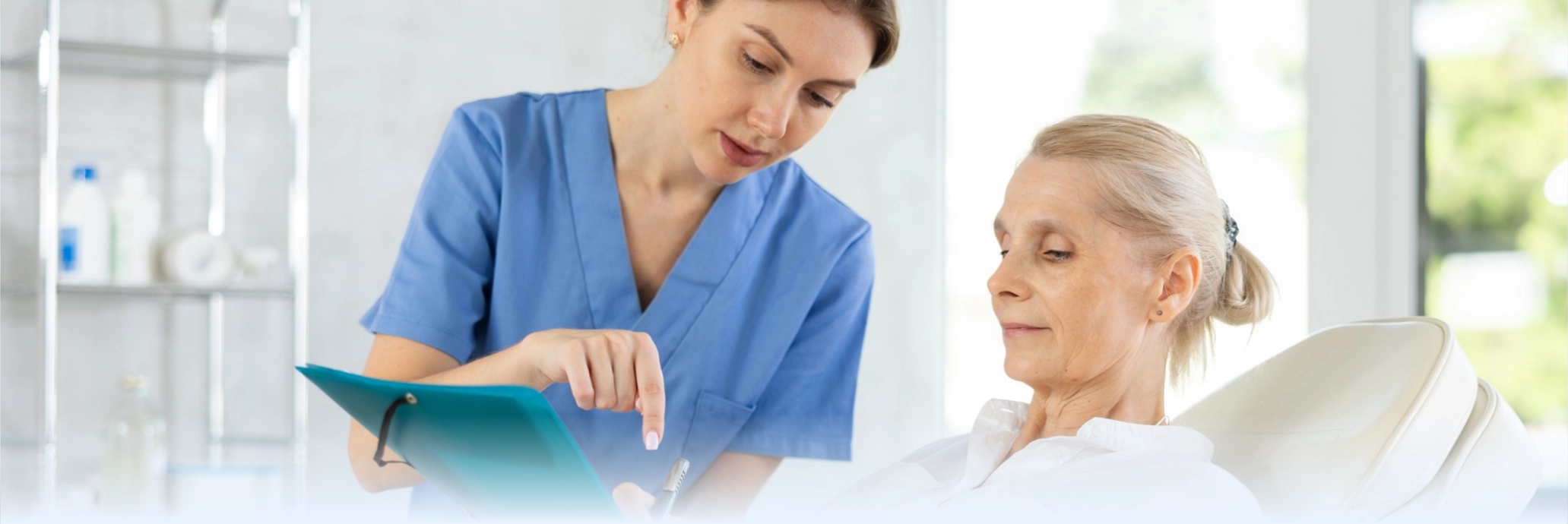 Healthcare professional reviewing tablet information with a patient