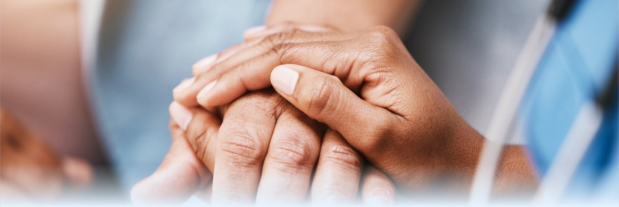 Hands holding in a caring healthcare moment